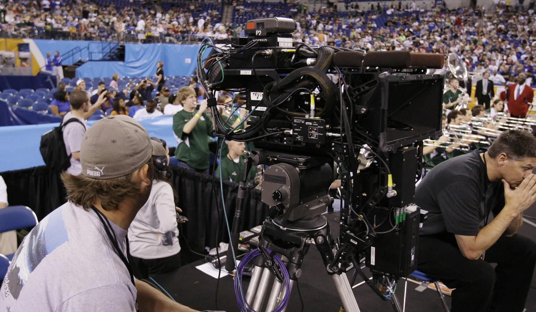 Live broadcast camera operator during championship final